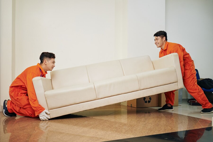 workers-carrying-heavy-couch_274689-11571